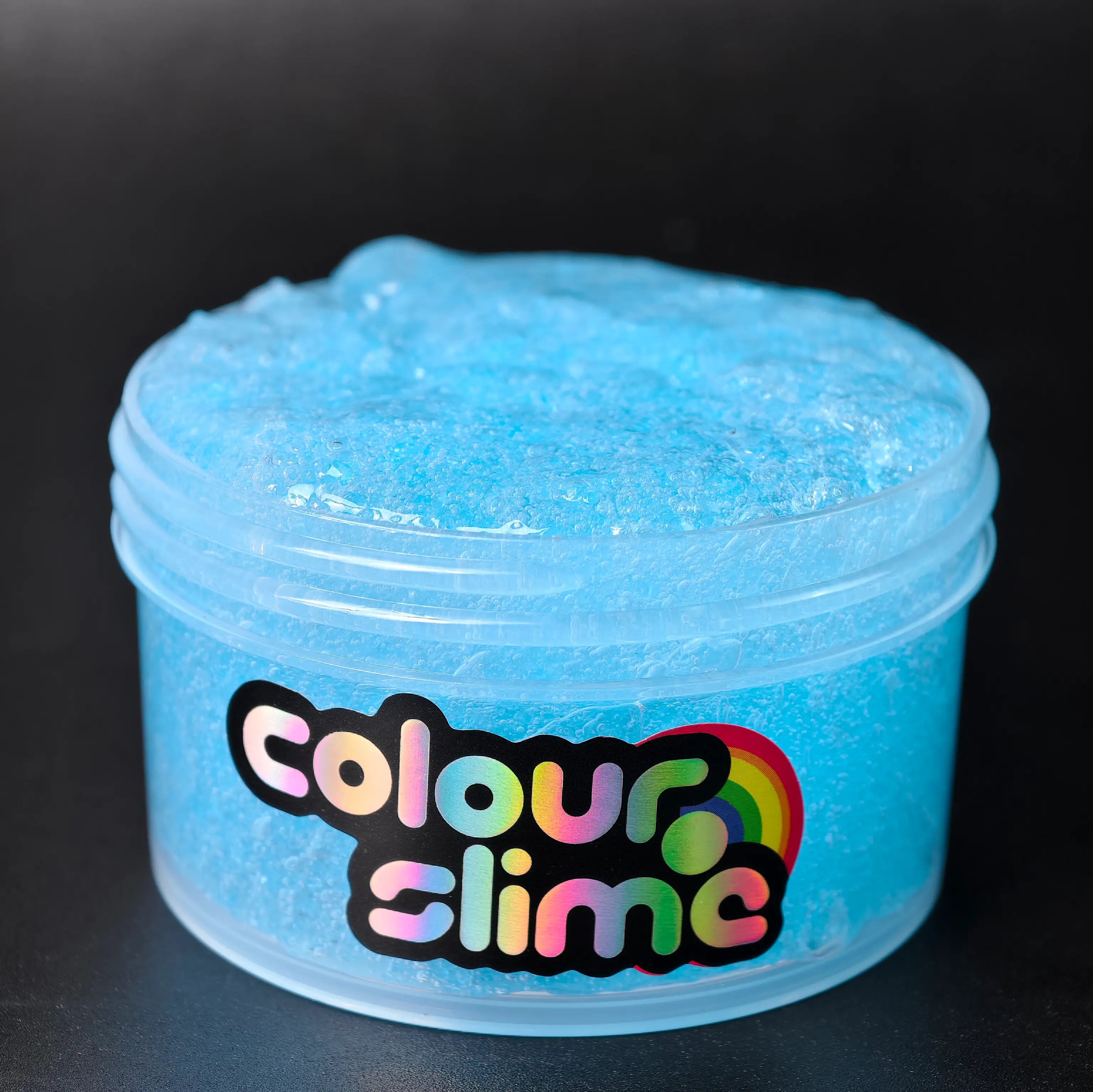 Blue slime in a container with 'colour slime' label on a black background