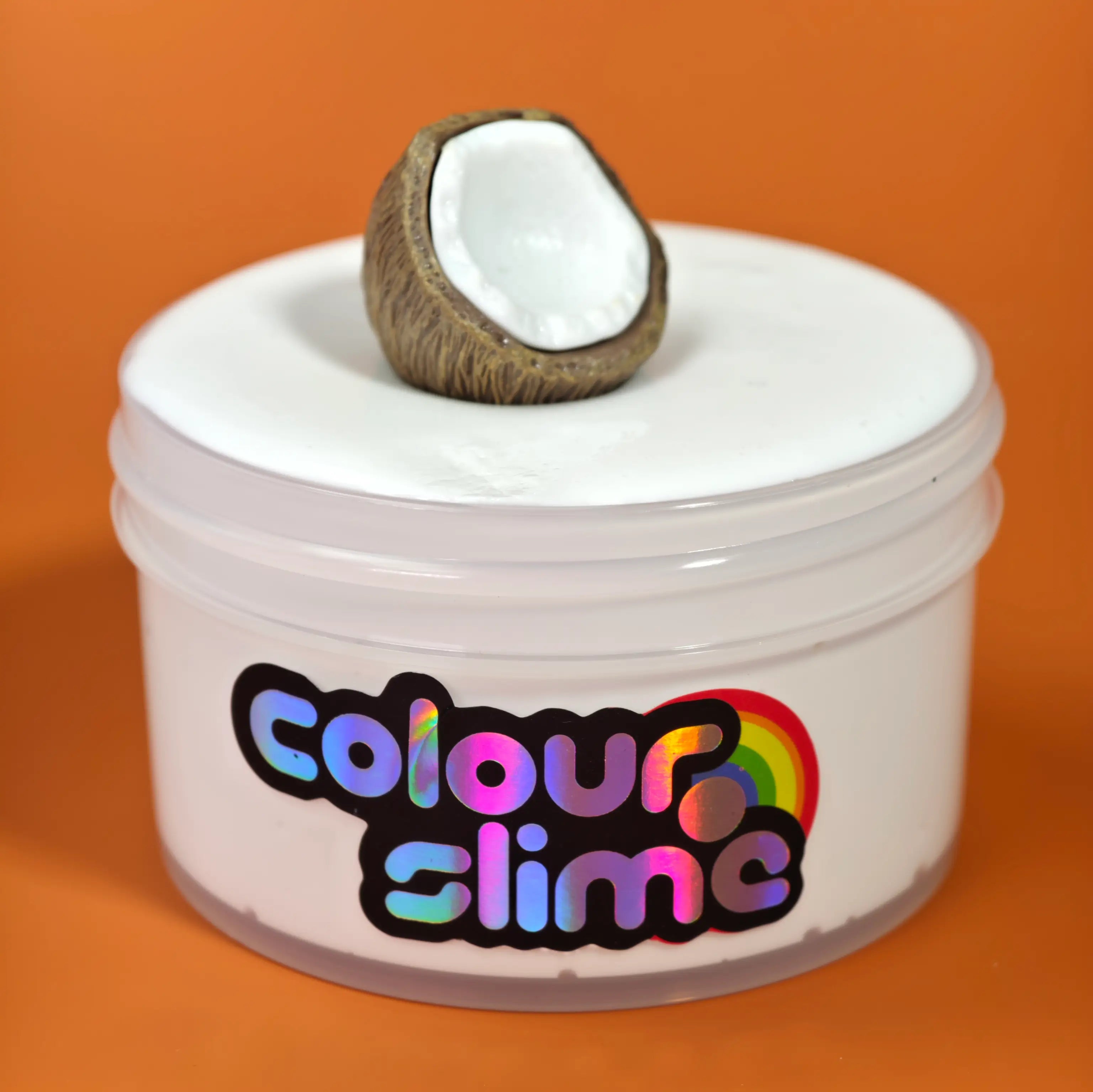 Coconut Cream Cloud white glue slime by Colour Slime in a clear jar, topped with a coconut charm and scented with sweet coconut vanilla cream.