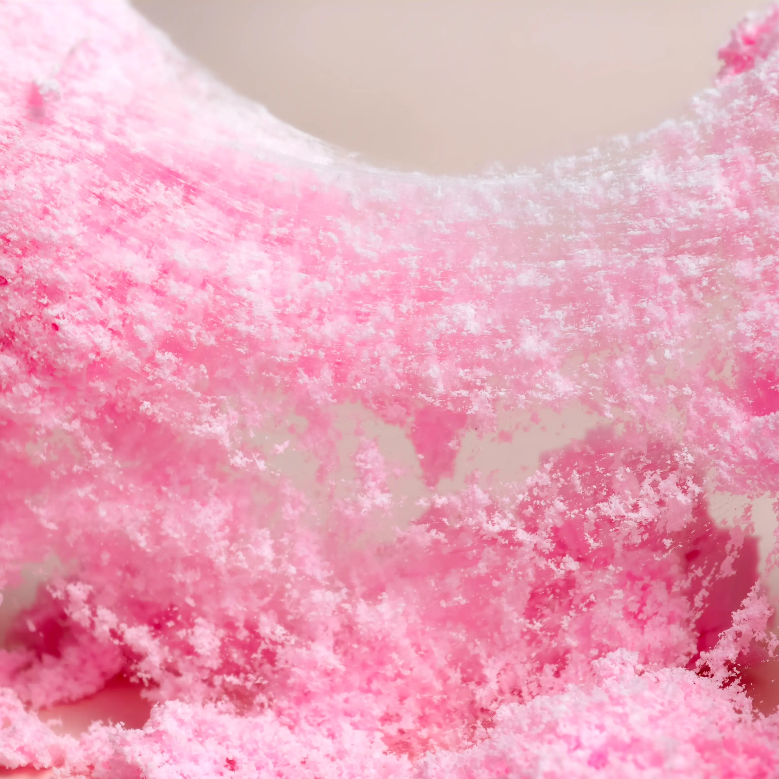 Close-up image of pink fluffy slime with a textured surface.